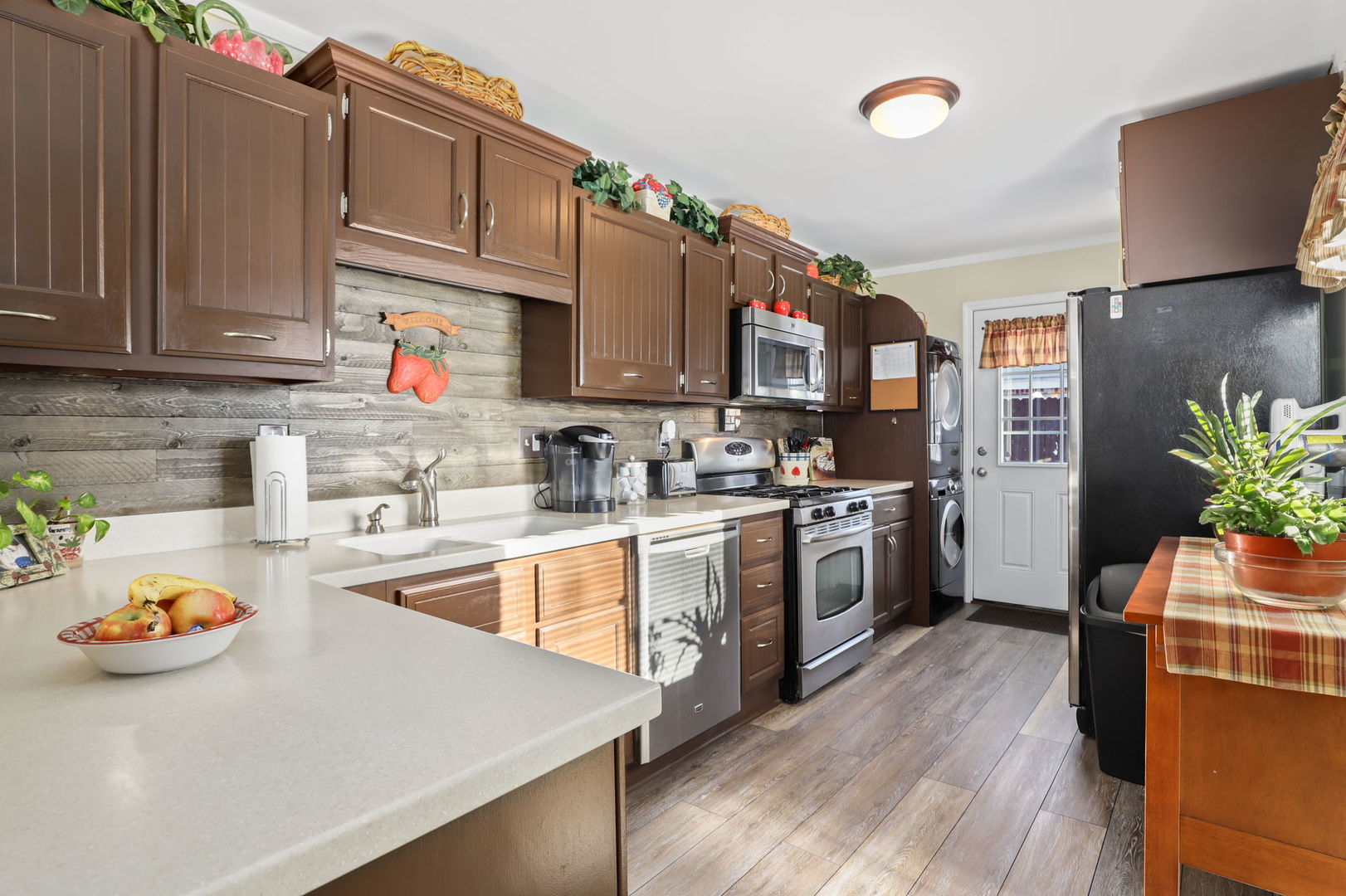 712 South Wayne Place Wheeling, IL 60090 - Photo 7 of 22 a kitchen with stainless steel appliances a stove a sink and a refrigerator