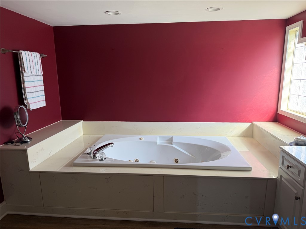 225 Lighthouse Pointe Hopewell, VA 23860 - Photo 14 of 23 a bathroom with a sink and a large mirror
