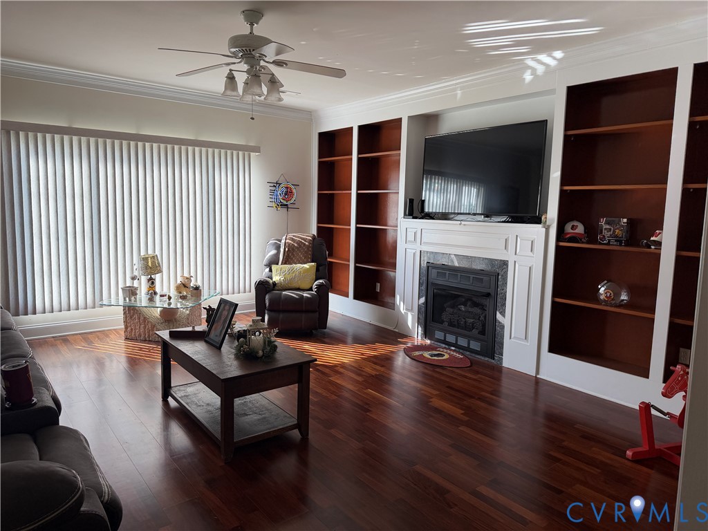 225 Lighthouse Pointe Hopewell, VA 23860 - Photo 23 of 23 a living room with furniture a flat screen tv and a fireplace