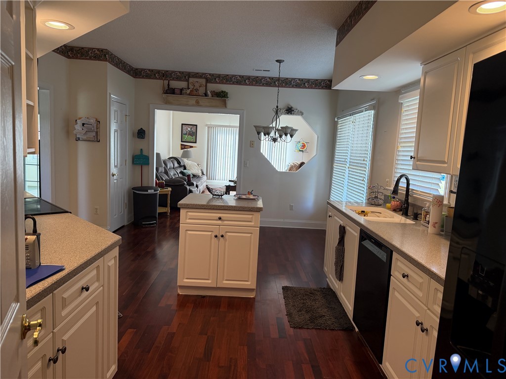 225 Lighthouse Pointe Hopewell, VA 23860 - Photo 7 of 23 a kitchen with a sink cabinets and wooden floor