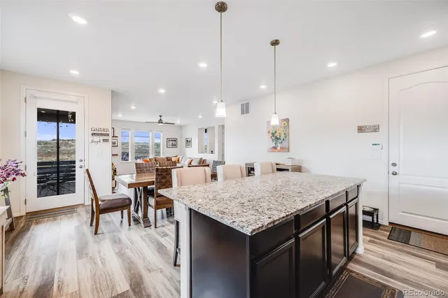 a kitchen with a table and chairs in it