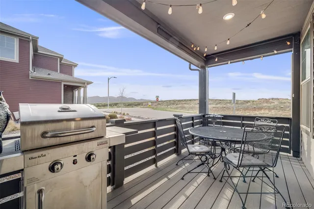 a view of a chairs and table in the terrace