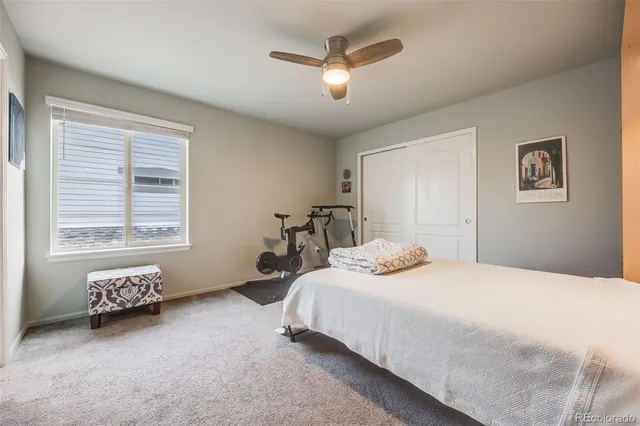 a bedroom with bed and window