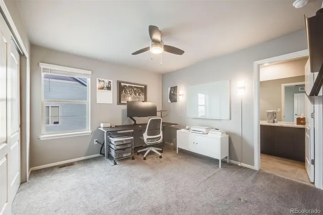 a view of a livingroom with furniture and a window
