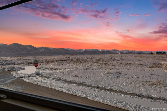 a view of a dry yard with mountain