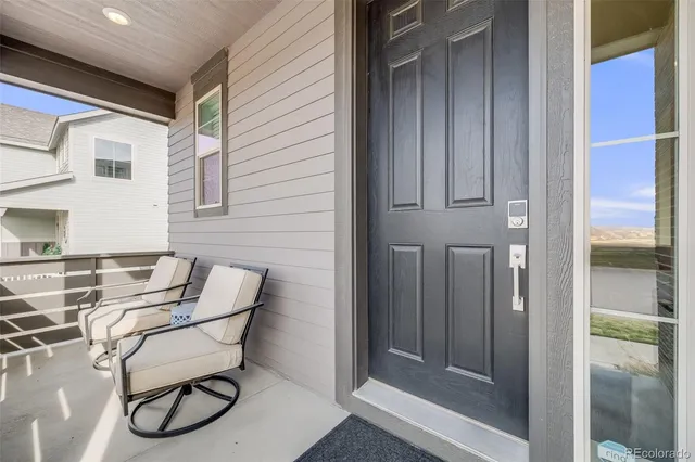 a patio with table and chairs