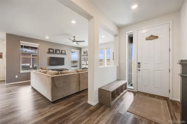a kitchen with stainless steel appliances a stove top oven and a refrigerator