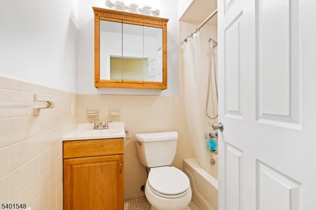 a bathroom with a toilet a sink and a shower