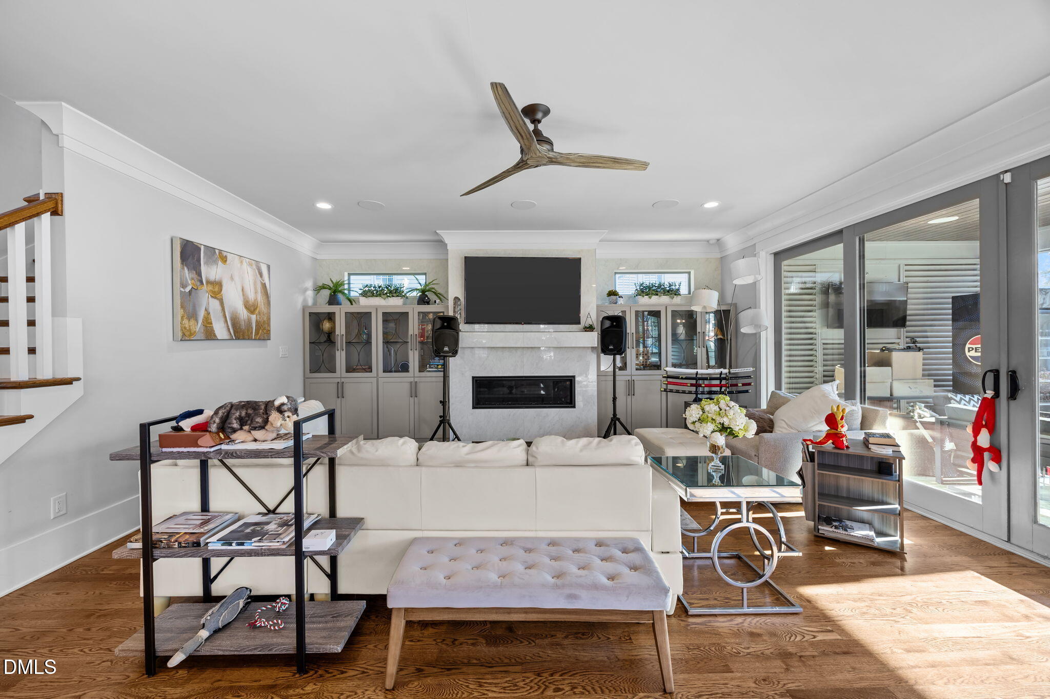 630 Daniels Street Raleigh, NC 27605 - Photo 14 of 34 a living room with furniture a flat screen tv and a fireplace