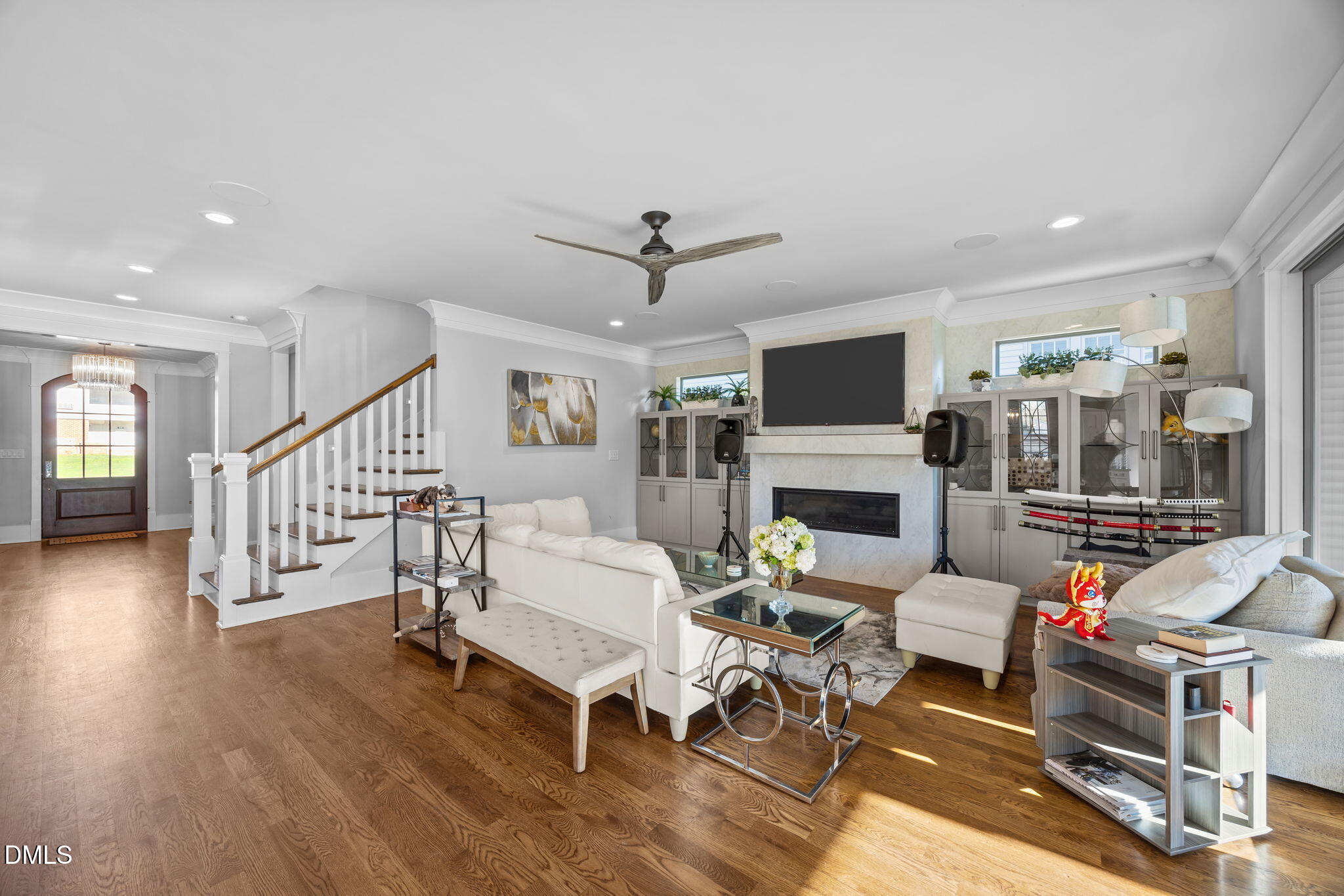 630 Daniels Street Raleigh, NC 27605 - Photo 15 of 34 a living room with furniture a fireplace and a flat screen tv