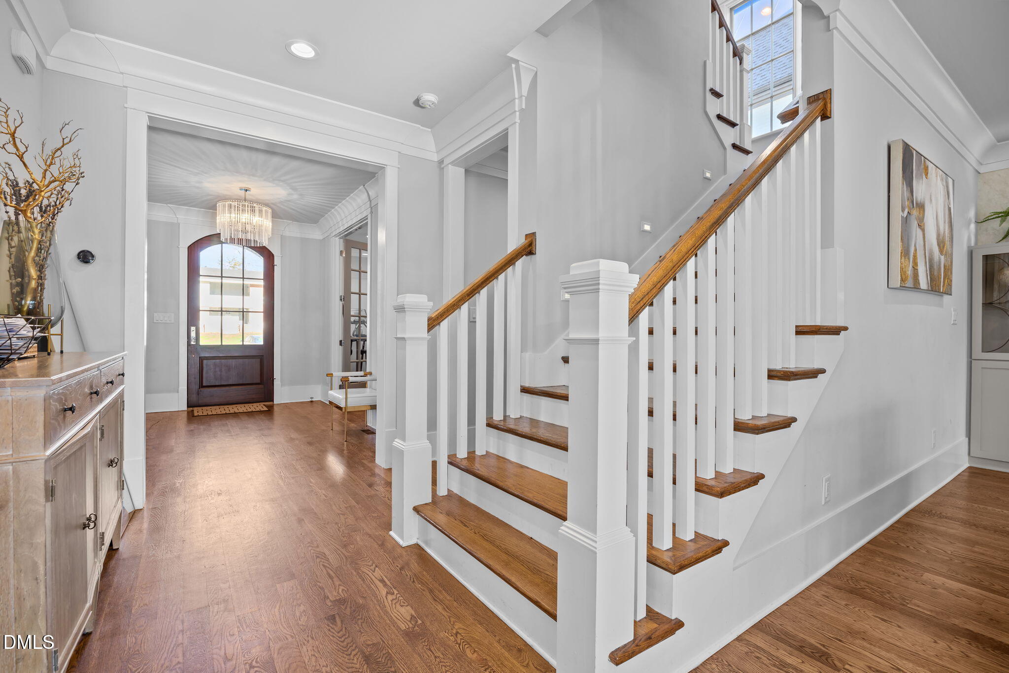 630 Daniels Street Raleigh, NC 27605 - Photo 16 of 34 a view of an entryway with wooden floor and staircase