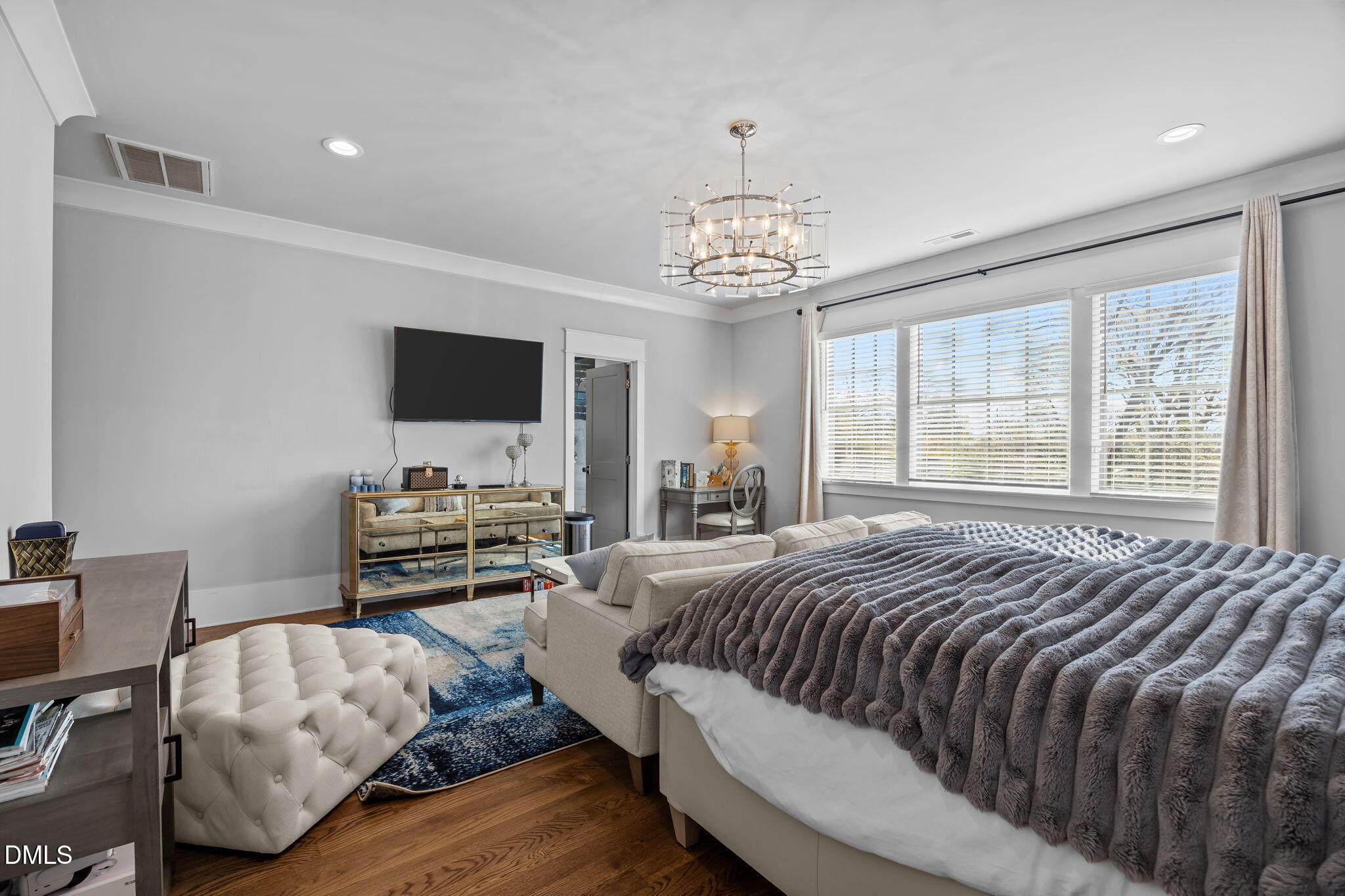 630 Daniels Street Raleigh, NC 27605 - Photo 18 of 34 a bedroom with a bed and a flat screen tv