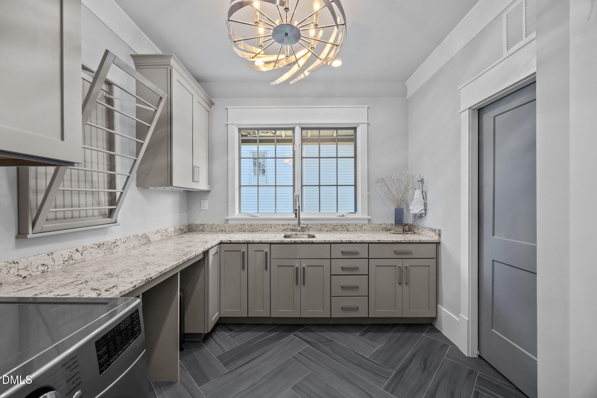 630 Daniels Street Raleigh, NC 27605 - Photo 21 of 34 a spacious bathroom with a granite countertop sink a large mirror and a window