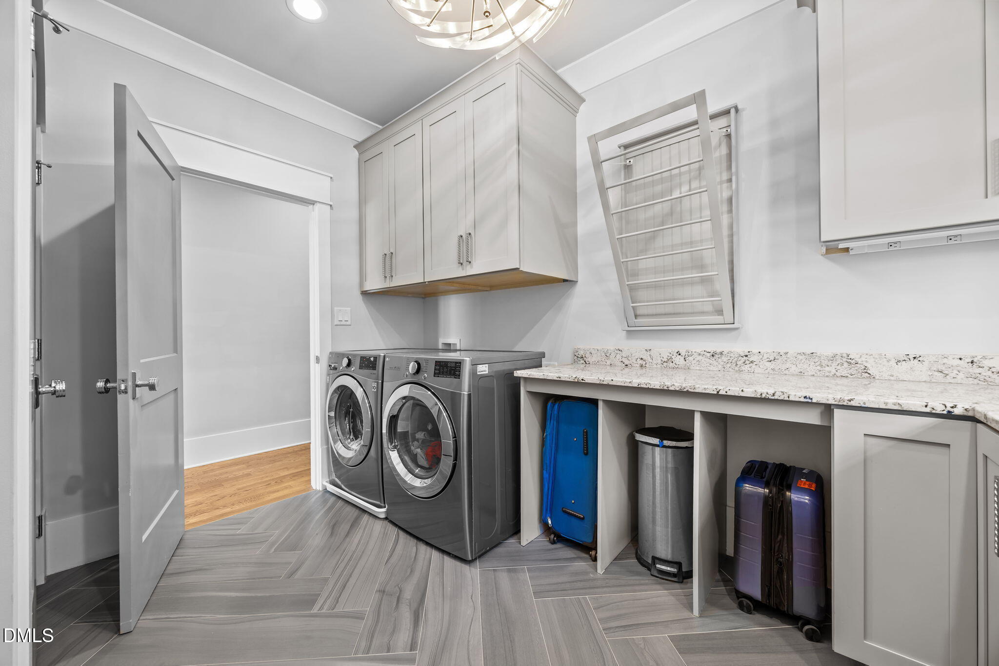 630 Daniels Street Raleigh, NC 27605 - Photo 22 of 34 a utility room with sink dryer and washer
