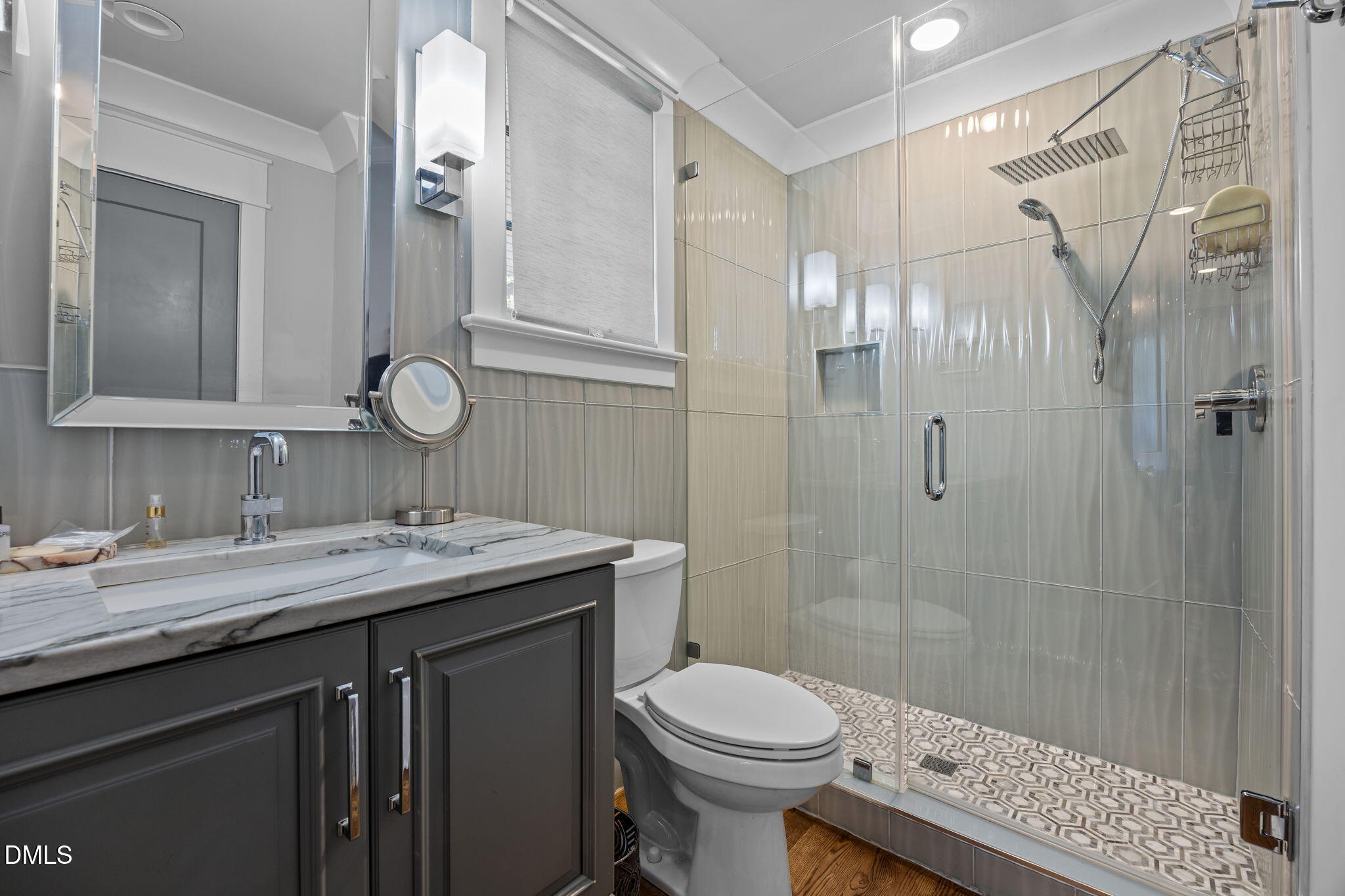 630 Daniels Street Raleigh, NC 27605 - Photo 24 of 34 a bathroom with a granite countertop sink toilet and shower