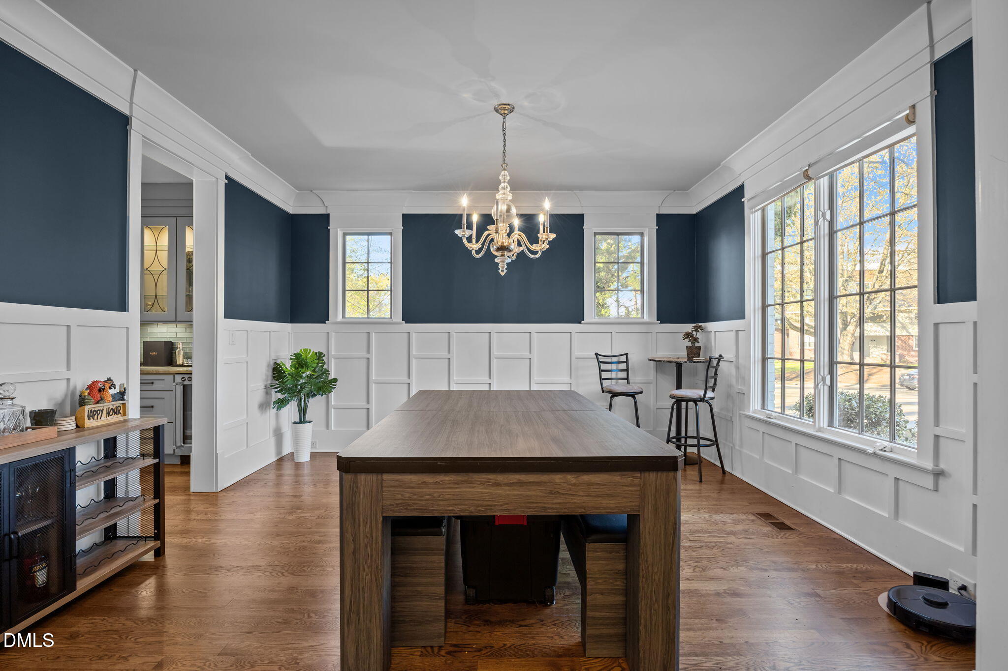 630 Daniels Street Raleigh, NC 27605 - Photo 4 of 34 a view of a dining room with furniture window and wooden floor