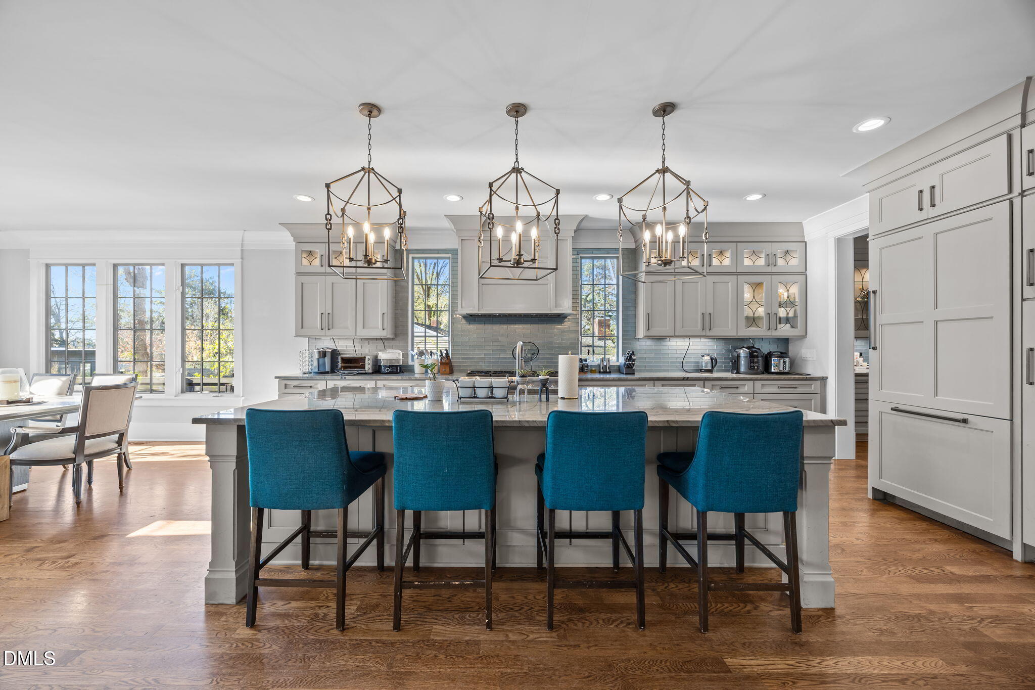 630 Daniels Street Raleigh, NC 27605 - Photo 6 of 34 a kitchen with stainless steel appliances granite countertop a table chairs stove and kitchen view