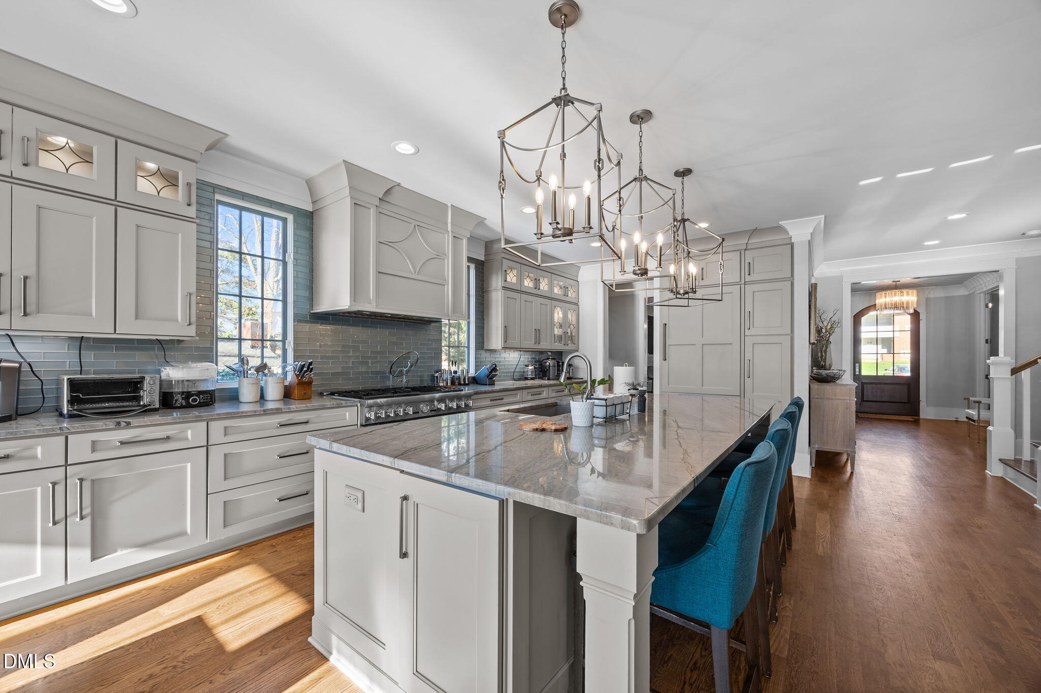 630 Daniels Street Raleigh, NC 27605 - Photo 7 of 34 a kitchen with stainless steel appliances granite countertop a sink refrigerator and cabinets