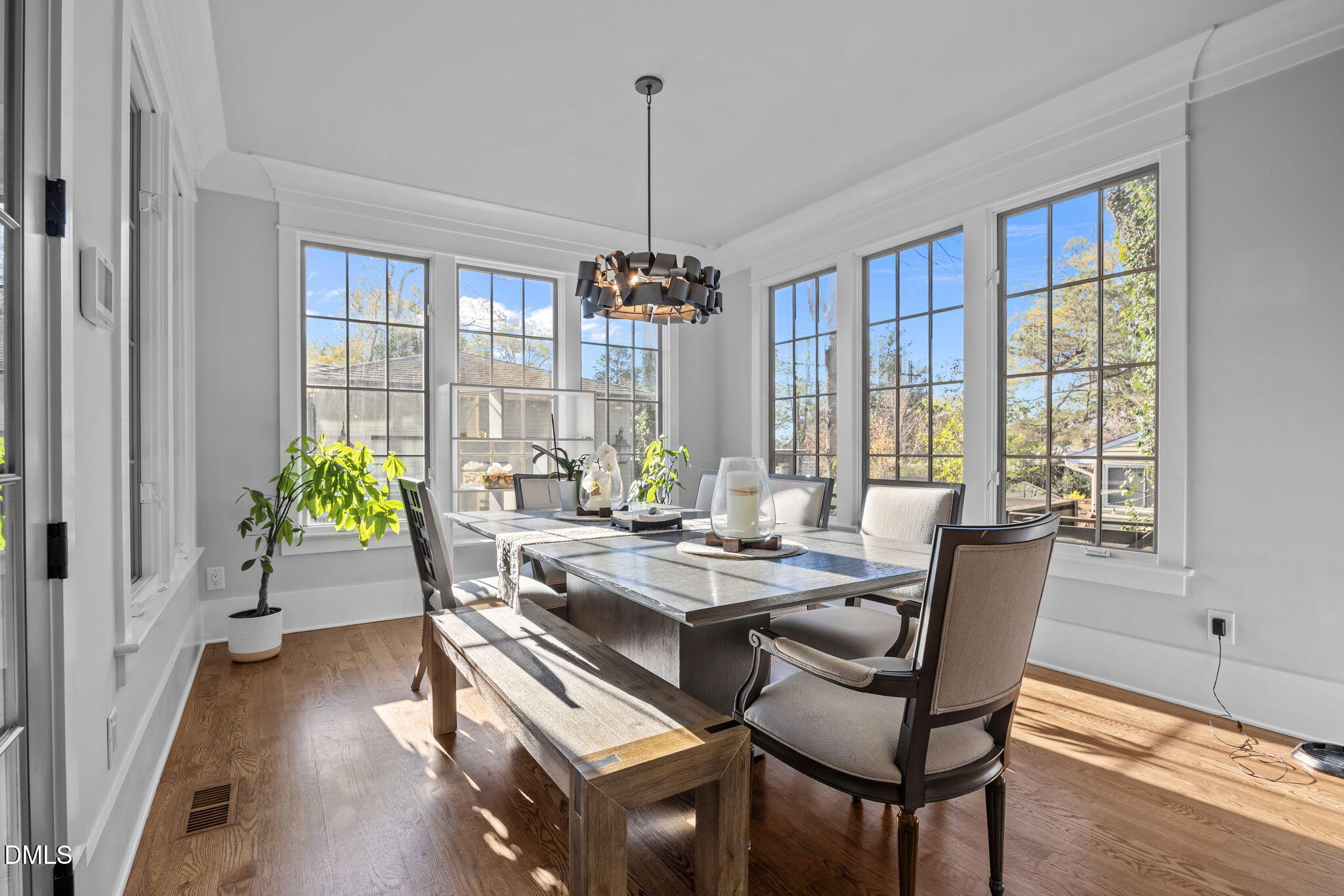 630 Daniels Street Raleigh, NC 27605 - Photo 10 of 34 a dining room with furniture window wooden floor