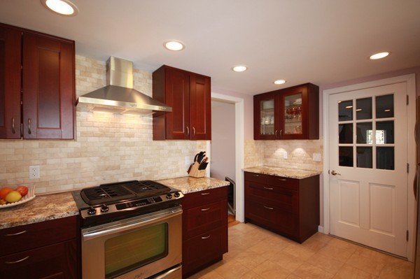 328 Quinobequin Road Newton, MA 02468 - Photo 1 of 22 a kitchen with stainless steel appliances granite countertop a stove and a sink