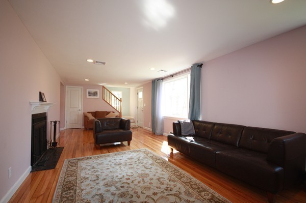 328 Quinobequin Road Newton, MA 02468 - Photo 4 of 22 a living room with furniture and a couch