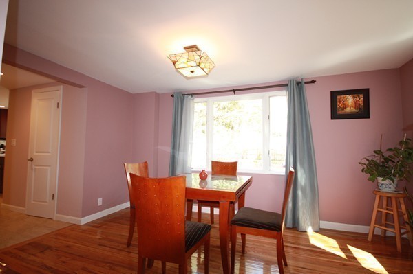 328 Quinobequin Road Newton, MA 02468 - Photo 8 of 22 a view of a dining room with furniture window and wooden floor