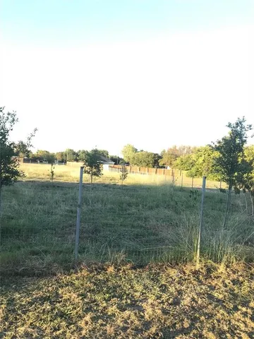 a view of lake with green space