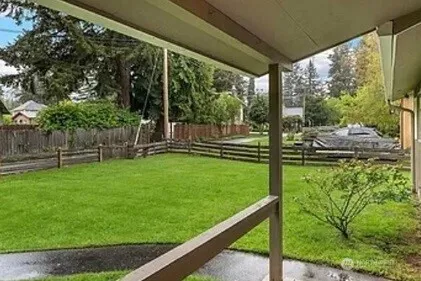a view of a chair and table in the garden