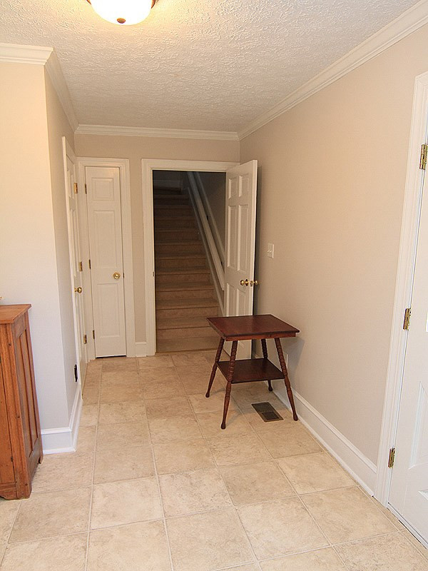 5016 Trail Ridge Drive Raleigh, NC 27613 - Photo 13 of 25 Enter the Mud Room from the garage or the back deck. Back stairway leads to Bonus Room. Mud Room