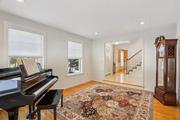 a bedroom with furniture and a rug