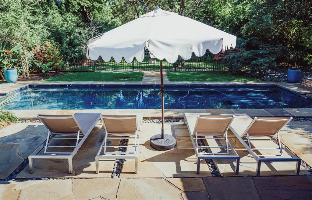 5301 West Mockingbird Lane Dallas, TX 75209 - Photo 13 of 35 a view of table and chairs with wooden fence