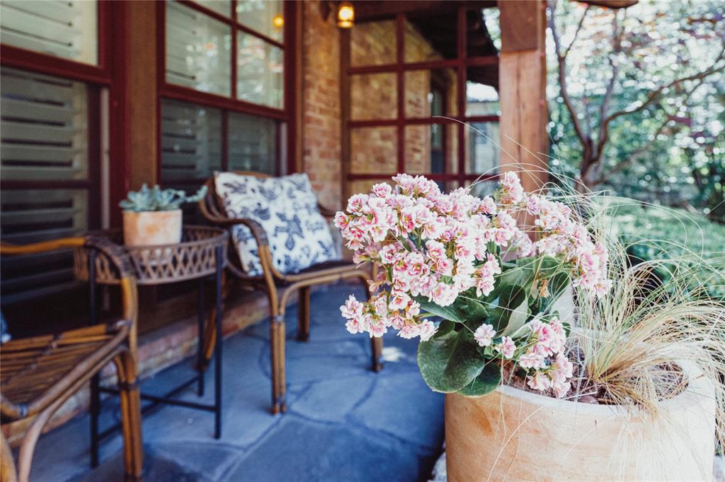 5301 West Mockingbird Lane Dallas, TX 75209 - Photo 21 of 35 a vase of flowers sitting on a table in front of a building