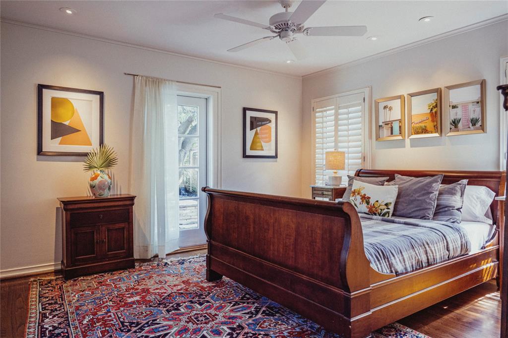 5301 West Mockingbird Lane Dallas, TX 75209 - Photo 7 of 35 a bed room with a bed and painting on the wall