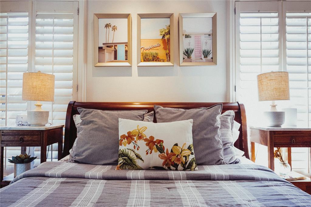 5301 West Mockingbird Lane Dallas, TX 75209 - Photo 8 of 35 a bed room with a bed and a painting on the wall