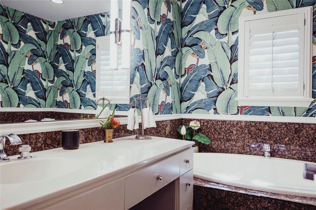 5301 West Mockingbird Lane Dallas, TX 75209 - Photo 10 of 35 a bathroom with a bathtub and a sink