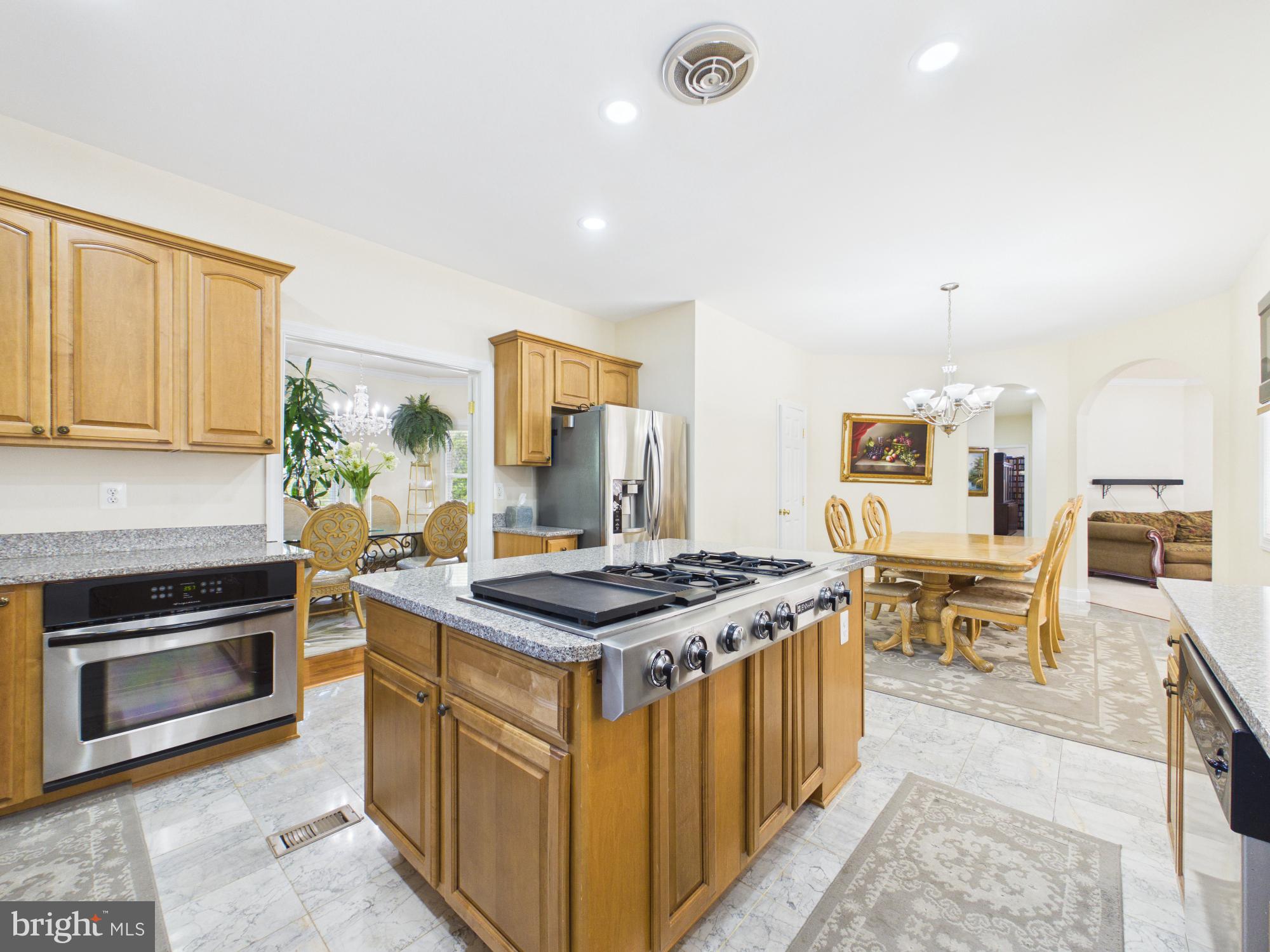 7801 Ridgewood Drive Annandale, VA 22003 - Photo 14 of 72 a kitchen that has a stove and a table