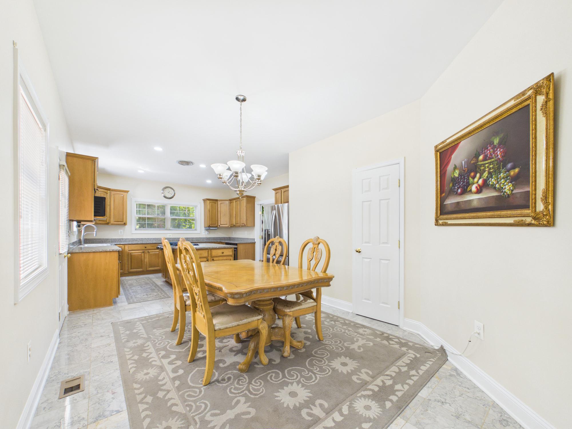 7801 Ridgewood Drive Annandale, VA 22003 - Photo 22 of 72 a dining room with a table and chairs