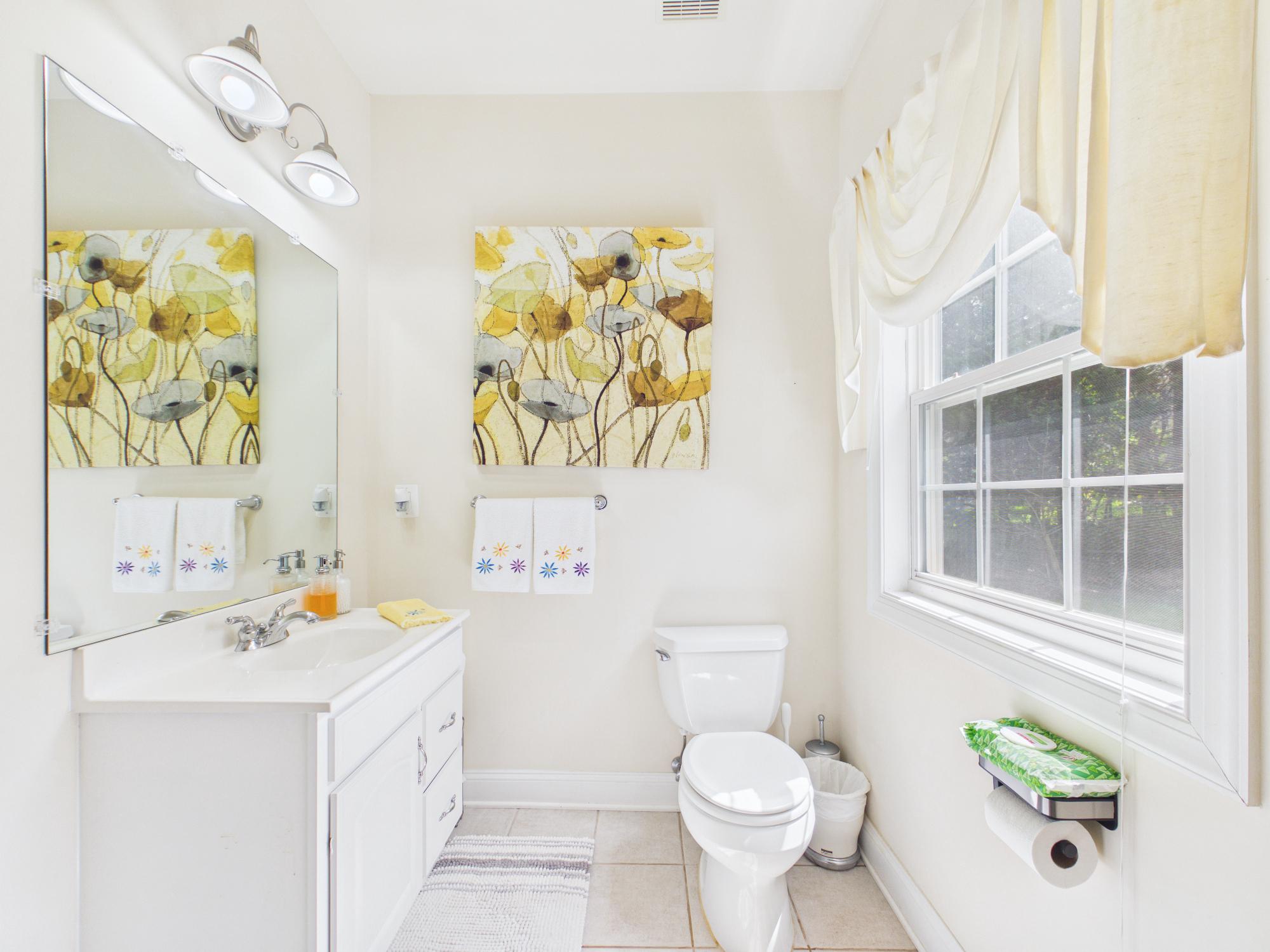 7801 Ridgewood Drive Annandale, VA 22003 - Photo 27 of 72 a bathroom with a sink a toilet and a shower curtain