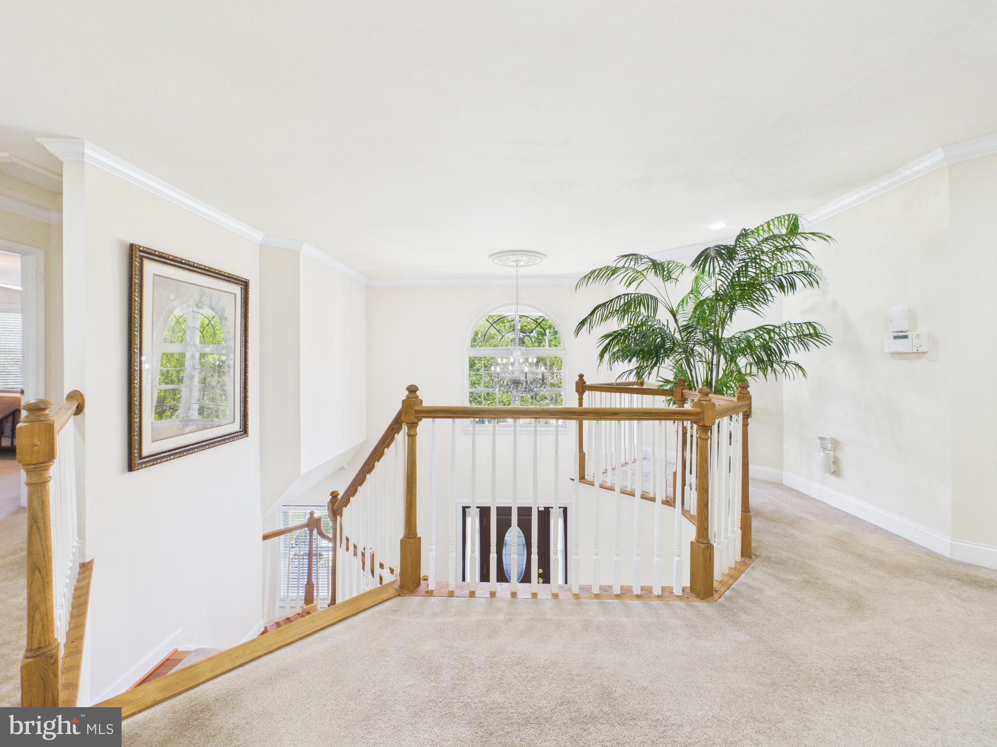 7801 Ridgewood Drive Annandale, VA 22003 - Photo 30 of 72 a view of staircase with white walls and a window