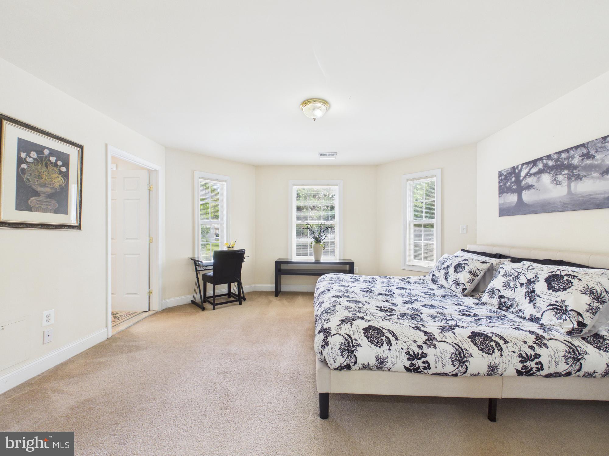 7801 Ridgewood Drive Annandale, VA 22003 - Photo 39 of 72 a bedroom with a bed and chair
