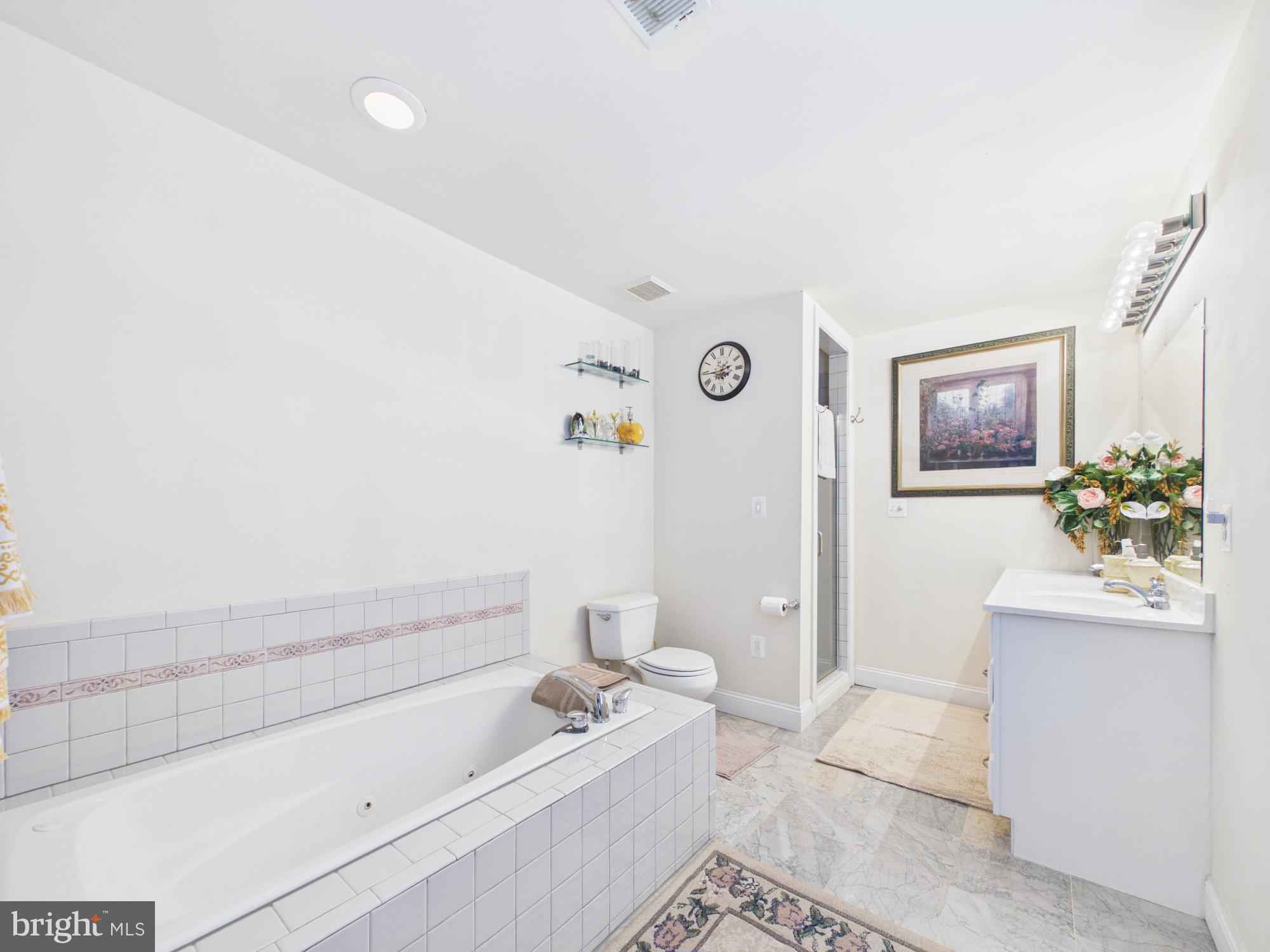 7801 Ridgewood Drive Annandale, VA 22003 - Photo 40 of 72 a bathroom with a bathtub sink and toilet