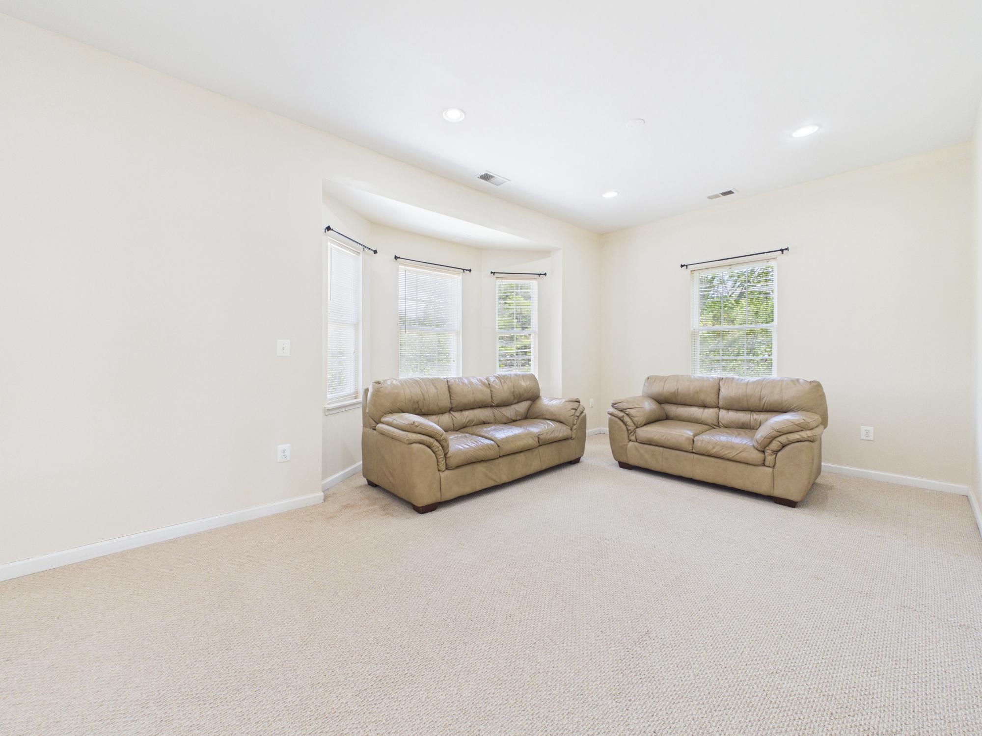 7801 Ridgewood Drive Annandale, VA 22003 - Photo 46 of 72 a living room with furniture and a window