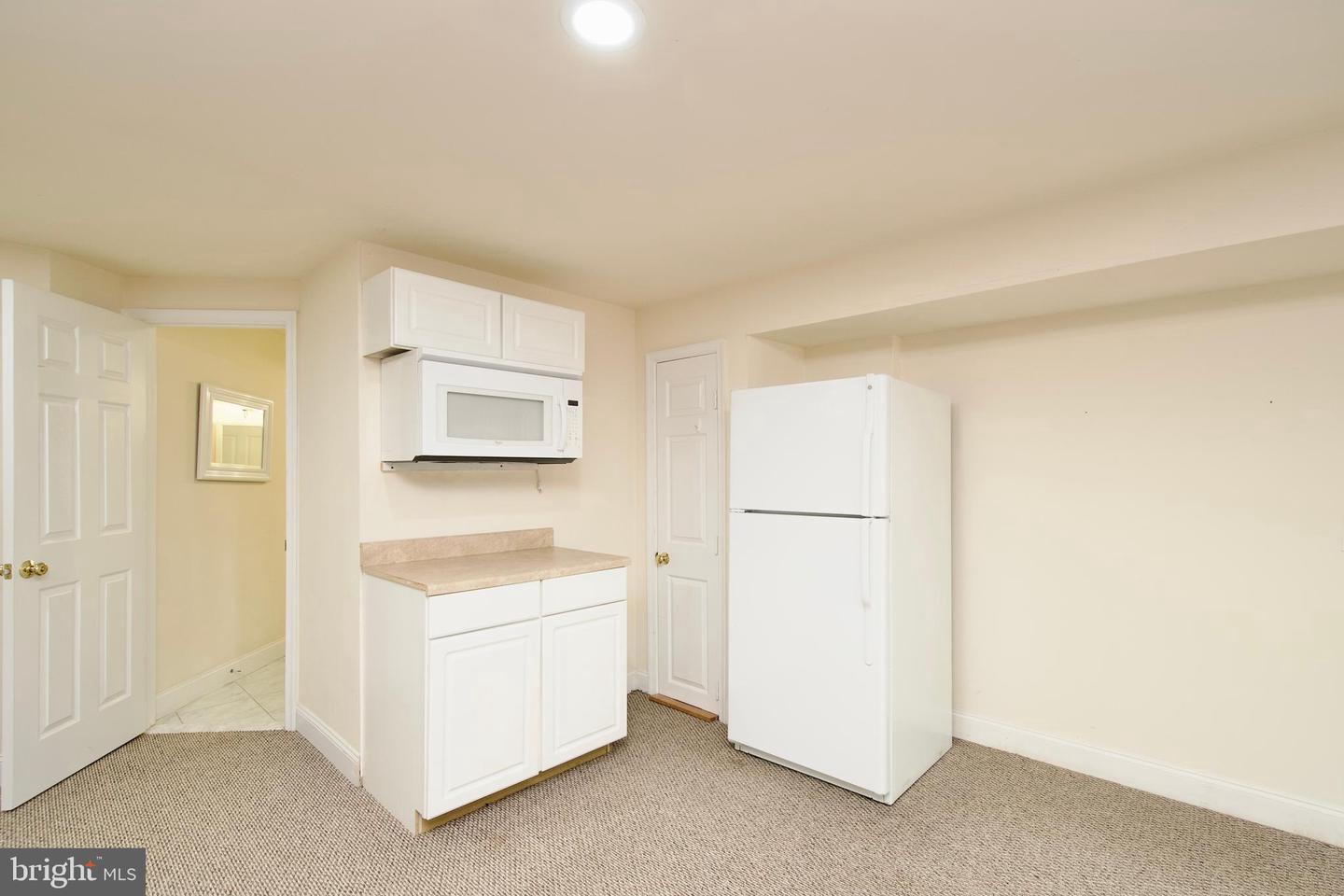 7801 Ridgewood Drive Annandale, VA 22003 - Photo 50 of 72 a utility room with dryer and washer