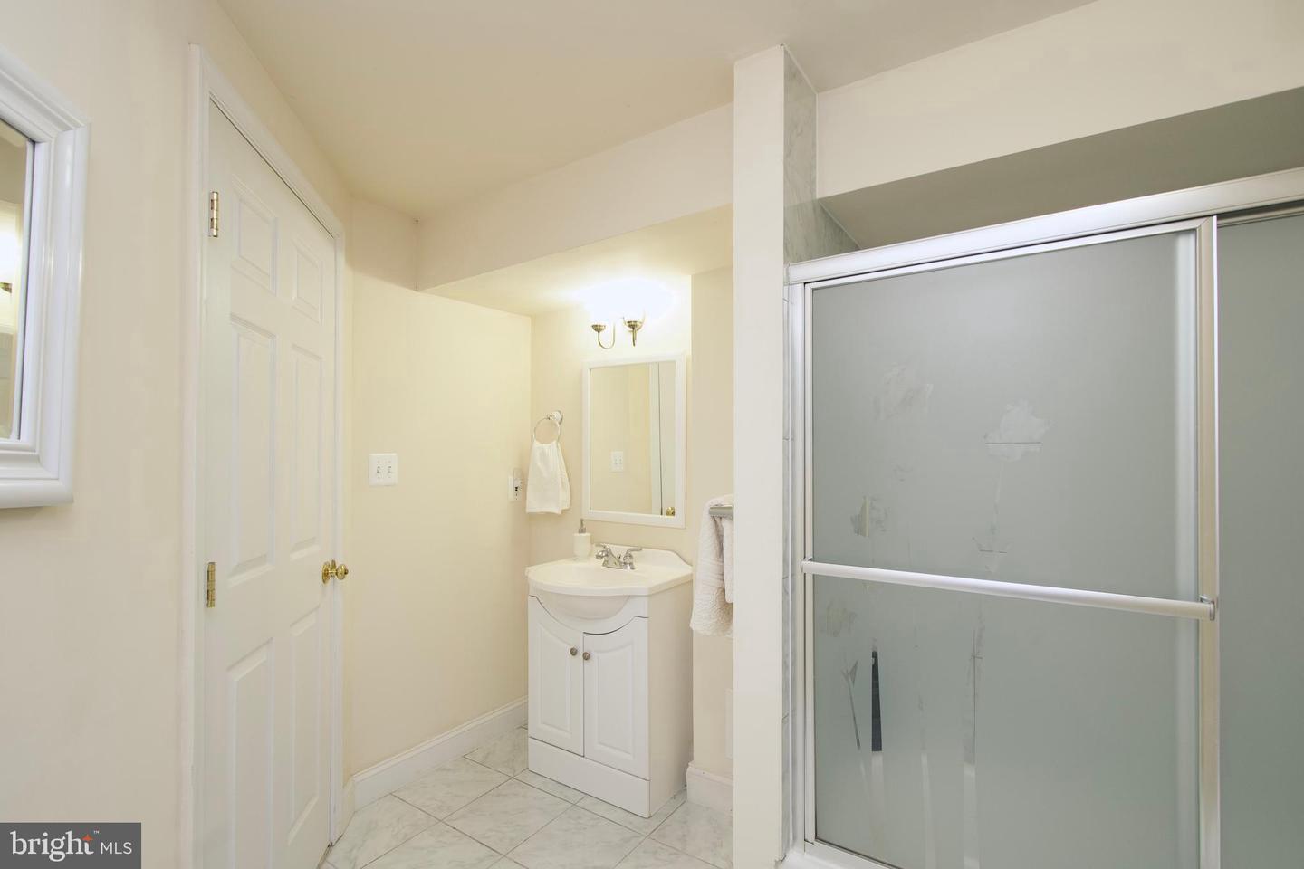 7801 Ridgewood Drive Annandale, VA 22003 - Photo 51 of 72 a bathroom with a shower and a sink