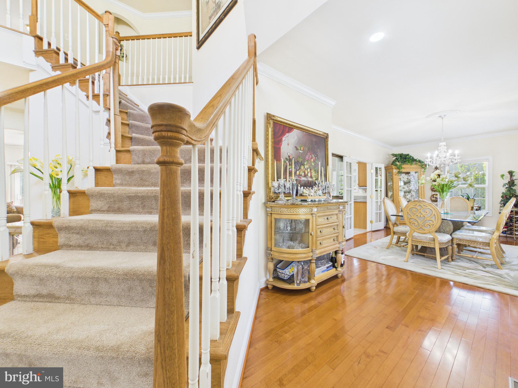 7801 Ridgewood Drive Annandale, VA 22003 - Photo 8 of 72 Elegant entryway with staircase charm.