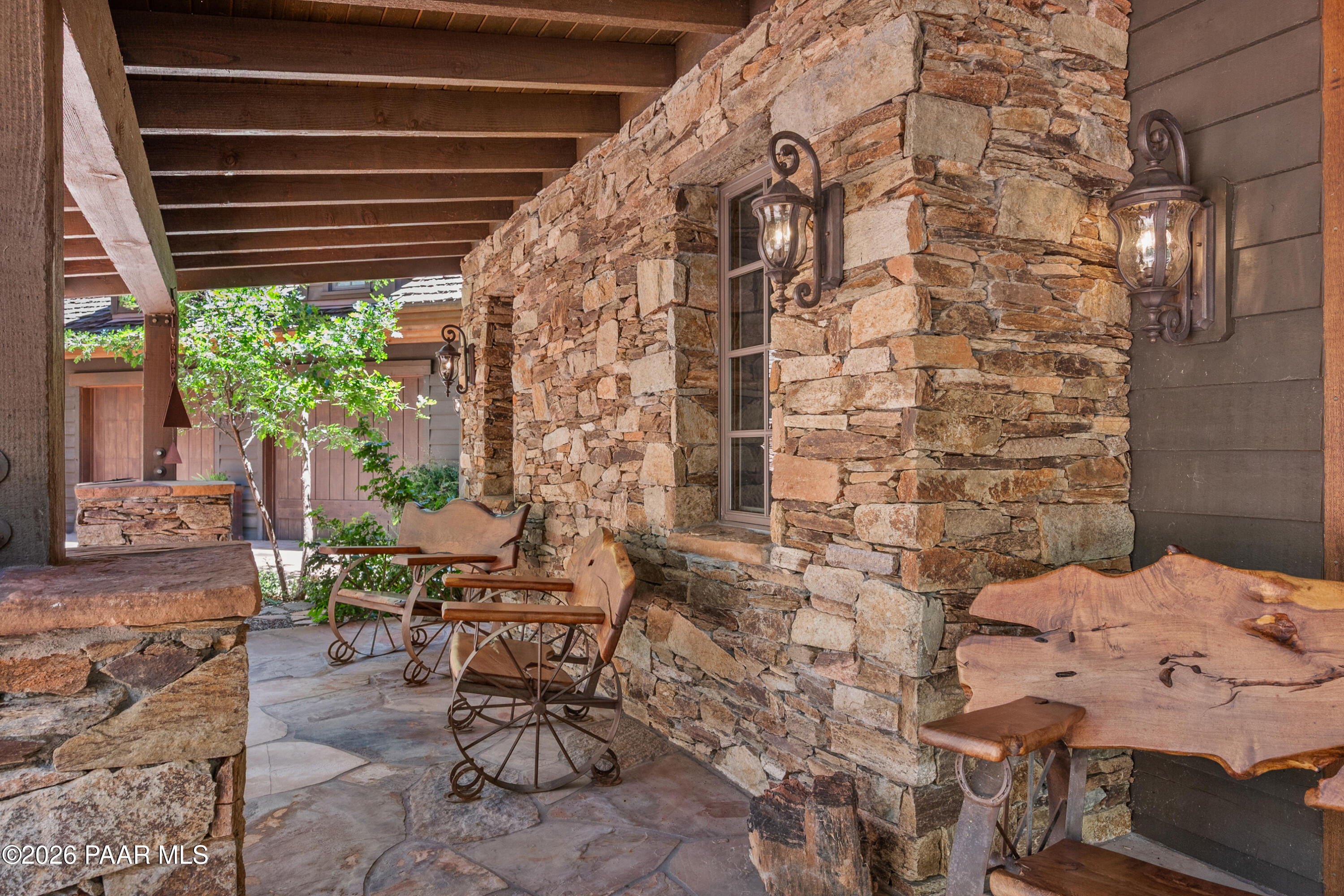 1515 High Valley Ranch Road Prescott, AZ 86303 - Photo 6 of 76 a patio with table and chairs and potted plants