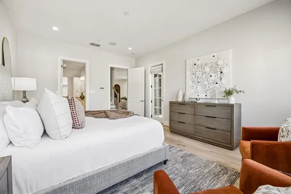 a bedroom with a bed and a couch