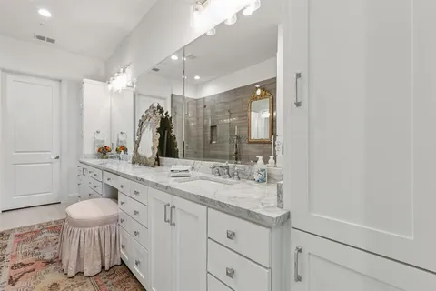 a view of a dining room with furniture and a chandelier