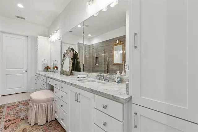 a view of a dining room with furniture and a chandelier