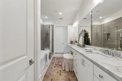 a bathroom with a granite countertop sink a toilet and a mirror